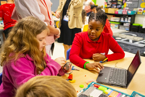 Two students engaging with project based learning inside a classroom